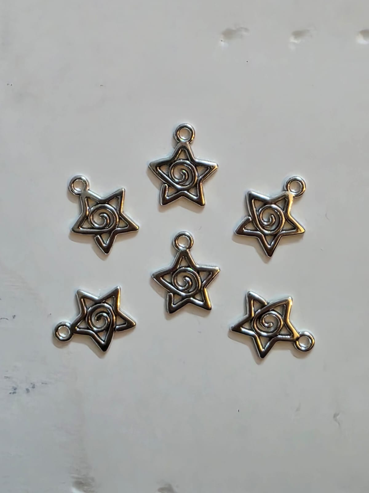 Spiral star charms