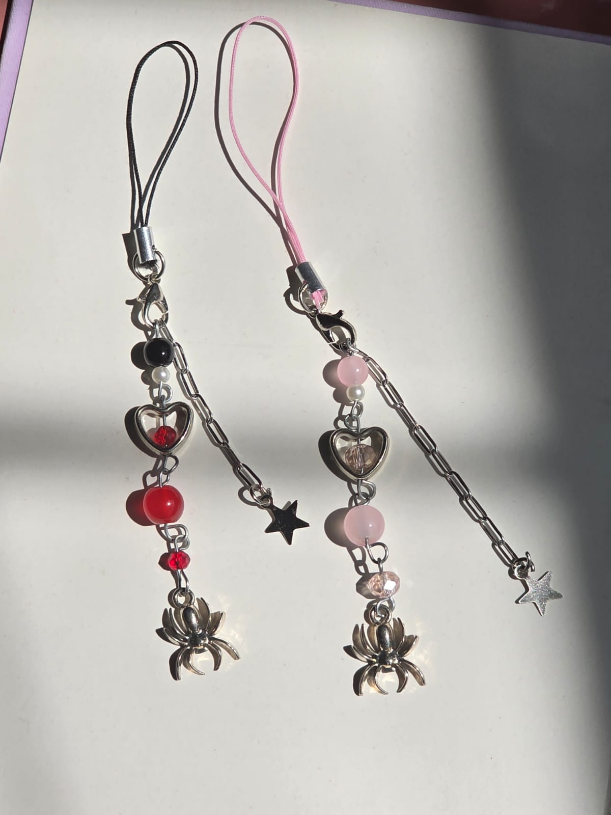 Spider girl and man matching phonecharms